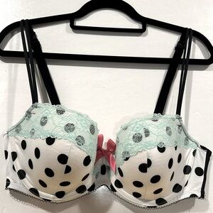 Cacique lightly padded underwire black polka dot-on-white bra. Size 38DD
